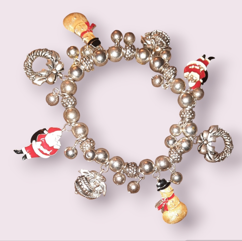 Avon Christmas charm and bead stretch bracelet needs cleaned